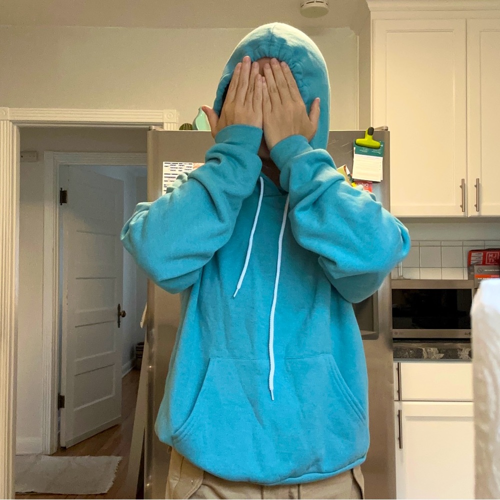 blue moving the needle hoodie